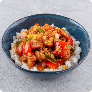 Chicken with rice in sweet and sour sauce